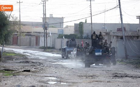 Iraqi army vehicles entering a neighborhood in southeastern Mosul. 