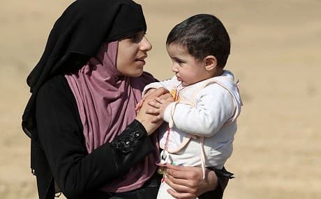 Refugees from a newly liberated neighborhood of Mosul. AFP photo