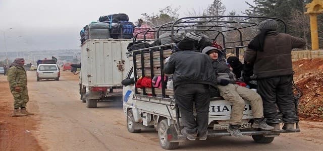 Syrian rebel fighters and civilians who were evacuated from rebel-held neighbourhoods in the embattled city of Aleppo arrive in the opposition-controlled Khan al-Aassal region, west of the embattled city, on December 16, 2016. Photo: AFP