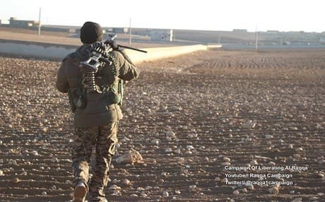 An SDF fighter approaches a recently liberated village north of Raqqa. Photo: Raqqa Liberation/Facebook