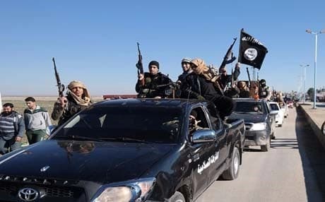 Convoy of ISIS militants in Mosul. AP file photo.