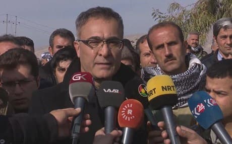 Khalid Azizi leader of the Kurdistan Democratic Party of Iran (PDK or HDK) speaks to reporters at the burial ceremony of five of his fighters who were killed when a twin bomb attack targeted his party's office in Koya. Photo: Rudaw video
