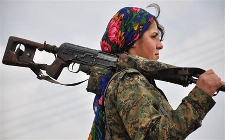  A Kurdish female fighter of the Women's Protection Units (YPJ) near the Syrian-Turkish border. Photo: AFP