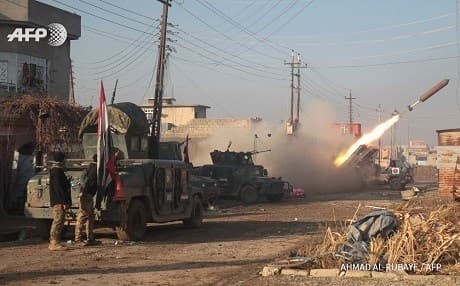 Iraqi forces fire a rocket from al-Intisar neighbourhood in east Mosul. Photo: Ahmad al-Rubaye/AFP