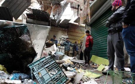 The aftermath of a blast in al-Sinak busy market. Photo: AFP