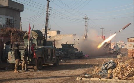 AFP photo of Iraqi forces when launching a rocket in Mosul's eastern Al-Intisar neighbourhood during an ongoing military operation against the group.