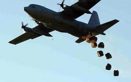A US air force C-130 cargo plane drops pallets of supplies over Syria . Photo: US Navy file photo