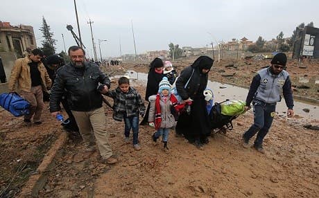 Mosul civilians in Arabi district, retaken by Iraqi forces over the weekend. Photo: AFP