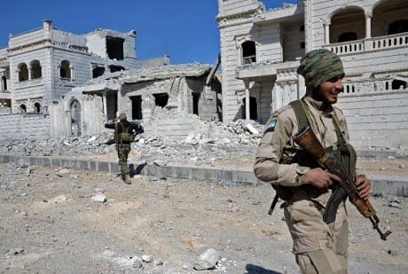 Rebel fighters, part of the Turkish-backed Operation Euphrates Shield, advance towards Al-Bab. Photo: AFP