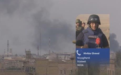 Hevidar Ahmed reports as smoke rises from western Mosul in Iraq. Photo: Rudaw TV