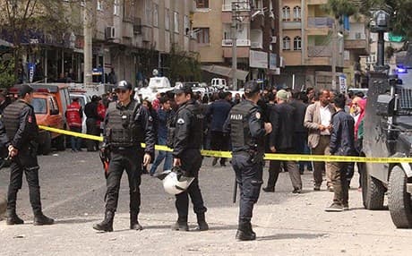 Turkish security investigate the scene of an explosion Diyarbakir on Tuesday. Photo: AA