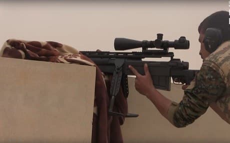 A member of the mainly-Kurdish Syrian Democratic Forces (SDF) takes aim as they push towards the strategic city of Tabqa, northern Syria. Photo: screen grab, SDF video.