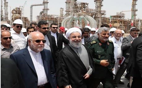 Iranian President Hassan Rouhani on Sunday (C) arrives for the opening of the Setareh Khalij Fars (Star of the Persian Gulf) refinery in the Gulf port city of Bandar Abbas. Photo: AFP/ hand out/ Iranian Presidency.