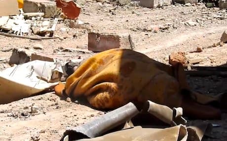 The dead body of a person wrapped in blanket found lain scattered on the ground amid tough clashes between ISIS and Iraqi army. Photo: Rudaw video