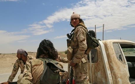 Members of the Syrian Elite Forces (SEF) on the eastern front in Raqqa. Photo: Delil Souleiman/AFP 