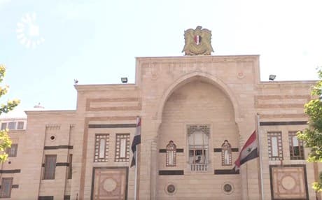 Riyaz Taus, a member of the Syrian parliament’s foreign affairs committee, and Abdulqadir Azuz, presidency consultant to the Syrian Council of Ministers, in Damascus.