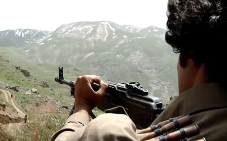 A Peshmerga fighter of the Iranian armed opposition guards a position in Kurdistan Region, only few kilometers away from the Iranian border in April, 2017. Photo: Rudaw TV