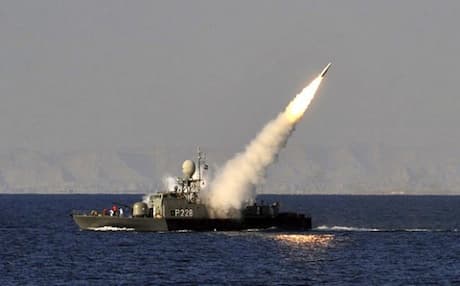An Iranian navy vessel launches a missile during a drill at the sea of Oman. January 2012. Photo: AP