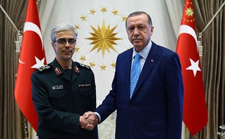 Iran's General Mohammad Bagheri shakes hands with Turkish President Recep Tayyip Erdogan after a rare meeting in Ankara. Photo: Kayhan Ozer/AFP