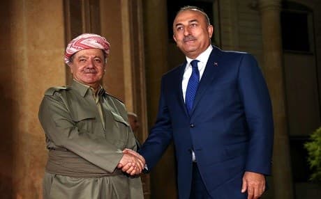 Kurdish president Masoud Barzani (left) shakes hands with Turkish Foreign Minister Mevlut Cavusoglu on August 23, 2017 in Erbil. Photo AFP/ Safin Hamed 