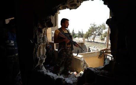 An SDF fighter holds a position in Raqqa on September 4. Photo: Delil Souleiman | AFP