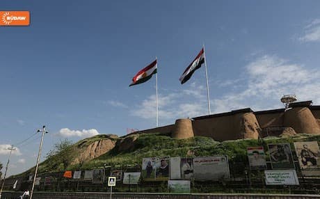 Kurdistan and Iraqi flags flying side-by-side over Kirkuk castle. Photo: Rudaw