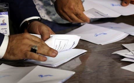 Kurdish officials in Erbil count votes and ballots after polls closed on September 25. Photo: Safin Hamed | AFP