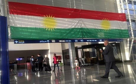 A Kurdish flag hangs in the Erbil International Airpor on Wednesday, Sept. 27, 2017. Iraq’s prime minister ordered the country’s Kurdish region to hand over control of its airports to federal authorities or face a flight ban, a response to the Kurdish independence referendum. Photo: AP/Khalid Mohammed