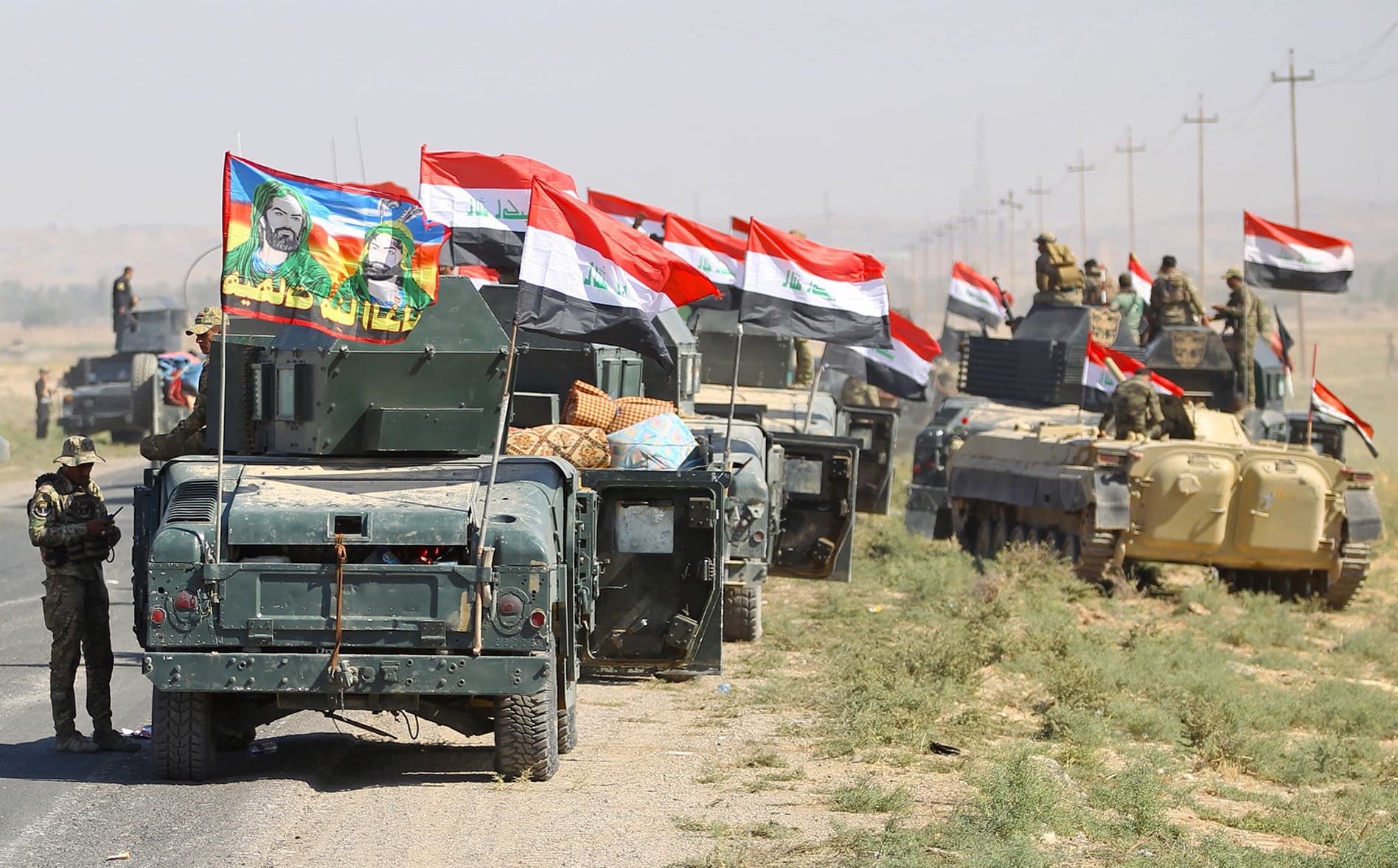 Iraqi forces advance on Kirkuk city on Monday. Photo: Ahmad al-Rubaye/AFP