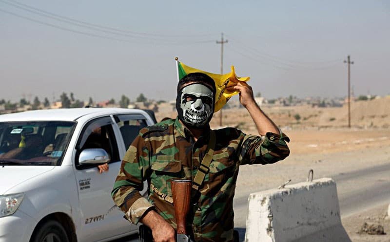 A member of the Hashd al-Shaabi stands guard in Tuz Khurmatu on Monday, October 16. Photo: AP