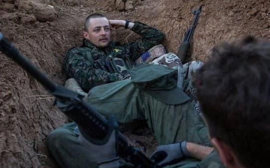 Jac Holmes, pictured here with the YPG in 2015, was killed in Raqqa. Photo: AFP