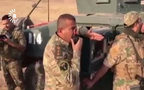 Screenshot from video footage released by the Hashd al-Shaabi militia shows Iraqi forces launching an attack aimed at Fishabur border crossing where the Iraqi, Turkish and Syrian borders meet. 
