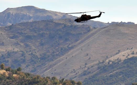 A Turkish military helicopter files over Hakkari’s mountainous border area with the Kurdistan Region. File photo: AFP