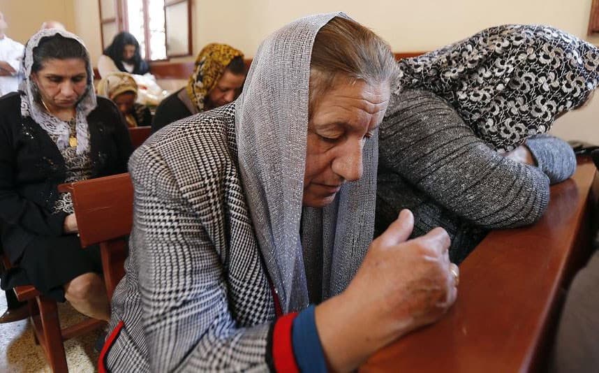 Assyrian Christian refugees from Iraq attend Mass at St. George’s Assyrian Church in Jdeideh, Lebanon. File photo: AFP
