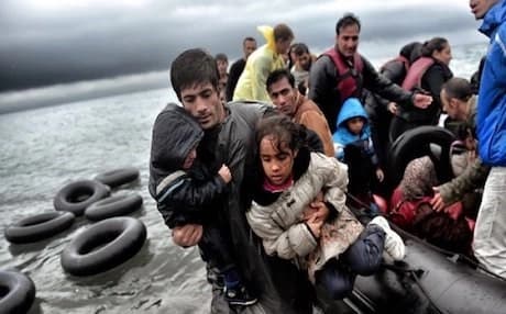Migrants land in Greece after crossing over from Turkey. AFP file photo 