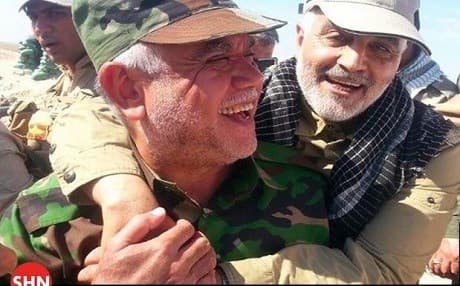Hadi al-Amiri, head of the Badr Organization and a commander of the Hashd al-Shaabi [L] and Qasem al-Soleimani, commander of the Iranian Quds Force. File photo: Shia News