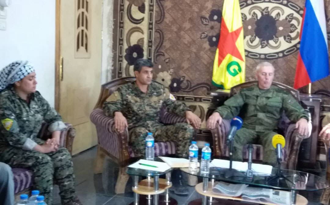 The YPG held a press conference with a Russian military official, announcing the defeat of ISIS east of the Euphrates River in Deir ez-Zor province, on Sunday. Photo: YPG