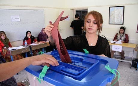 A woman casts her vote during the elections in September 2014. Photo: Rudaw