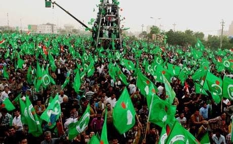 PUK supporters wave their party’s green flag during an election campaign in Erbil. Photo: Rudaw