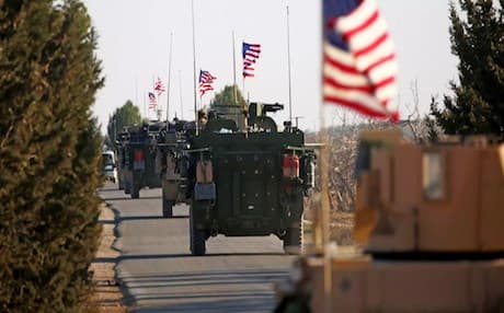 A US convoy drives through northern Syria in support of anti-ISIS operations. Photo: Delil Souliman | AFP