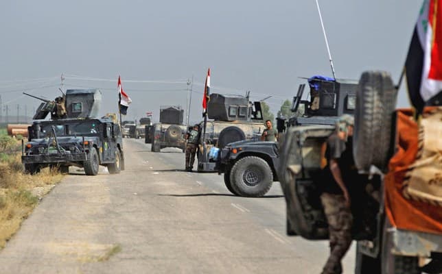 Iraqi and Hashd al-Shaabi forces advancing on ISIS in Hawija during military operations in the area in early October. File photo: AFP
