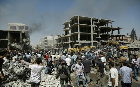 A double bombing killed 58 people in the Kurdish city of Qamishli, Rojava, northern Syria in July 2016. Photo: Delil Souleiman/AFP
