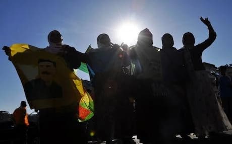 PKK supporters dance with picture of Ocalan during protests in Diyarbakir in June 2013. Photo: AFP