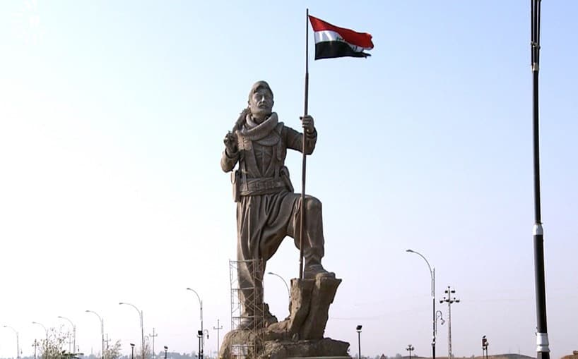 The Iraqi flag replaced the Kurdistan one on Kirkuk’s Peshmerga statue, guarding over the northern gate to the city, when control of the city was taken over by Iraqi forces in October. Photo: Hiwa Hussamadin/Rudaw