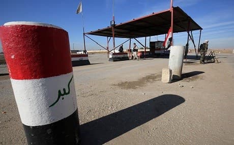 Paramilitiamen guard a Hashd al-Shaabi checkpoint near Qaryat Bazkartan in Nineveh Province. Photo: Ahmad al-Rubaye | AFP
