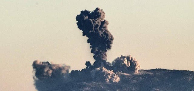 Smoke billows on the Syrian side of the border at Hassa near Hatay, southern Turkey on January 20, 2018 as Turkish jet fighters hit the People's Protection Units (YPG) positions. Photo: AFP / Bulent Kilic