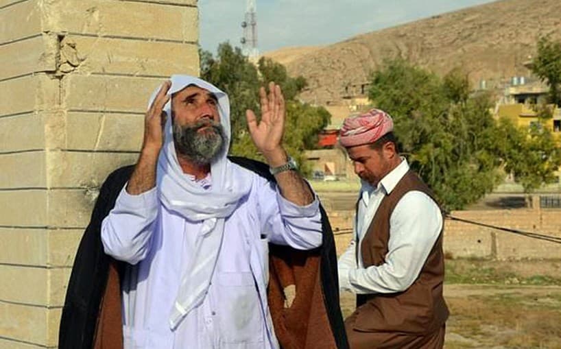 In Bashiqa earlier this month, Yezidis celebrate reopening a temple that had been destroyed by ISIS. Photo: AFP