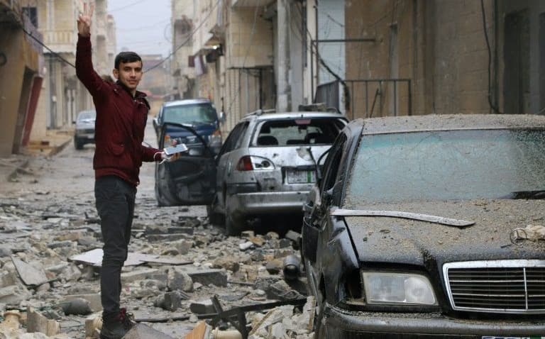 In Afrin’s Jindaris, a man stands in a rubble-strewn street on Wednesday. Photo: AFP