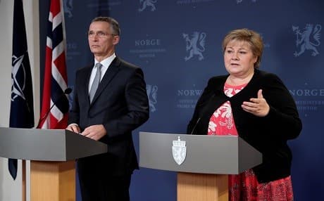 NATO head Jens Stoltenberg and Norwegian PM Erna Solberg speak at a press conference on Monday. Photo: Torbjorn Kjosvold | Norwegian Armed Forces