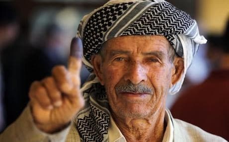 An Iraqi Kurdish man shows his ink-stained finger after voting during the Kurdistan's legislative election at a polling station on 21 September 2013 in the northern Kurdish city of Arbil. Photo: AFP/Ahmad al-Rubaye